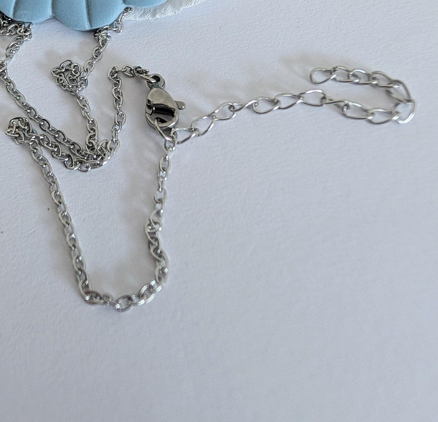 Art Deco necklace - Maya-inspired fan pendant made from polymer clay - Approximately 46 cm neck circumference - 316L surgical steel chain - Ballerina pink or Baby blue