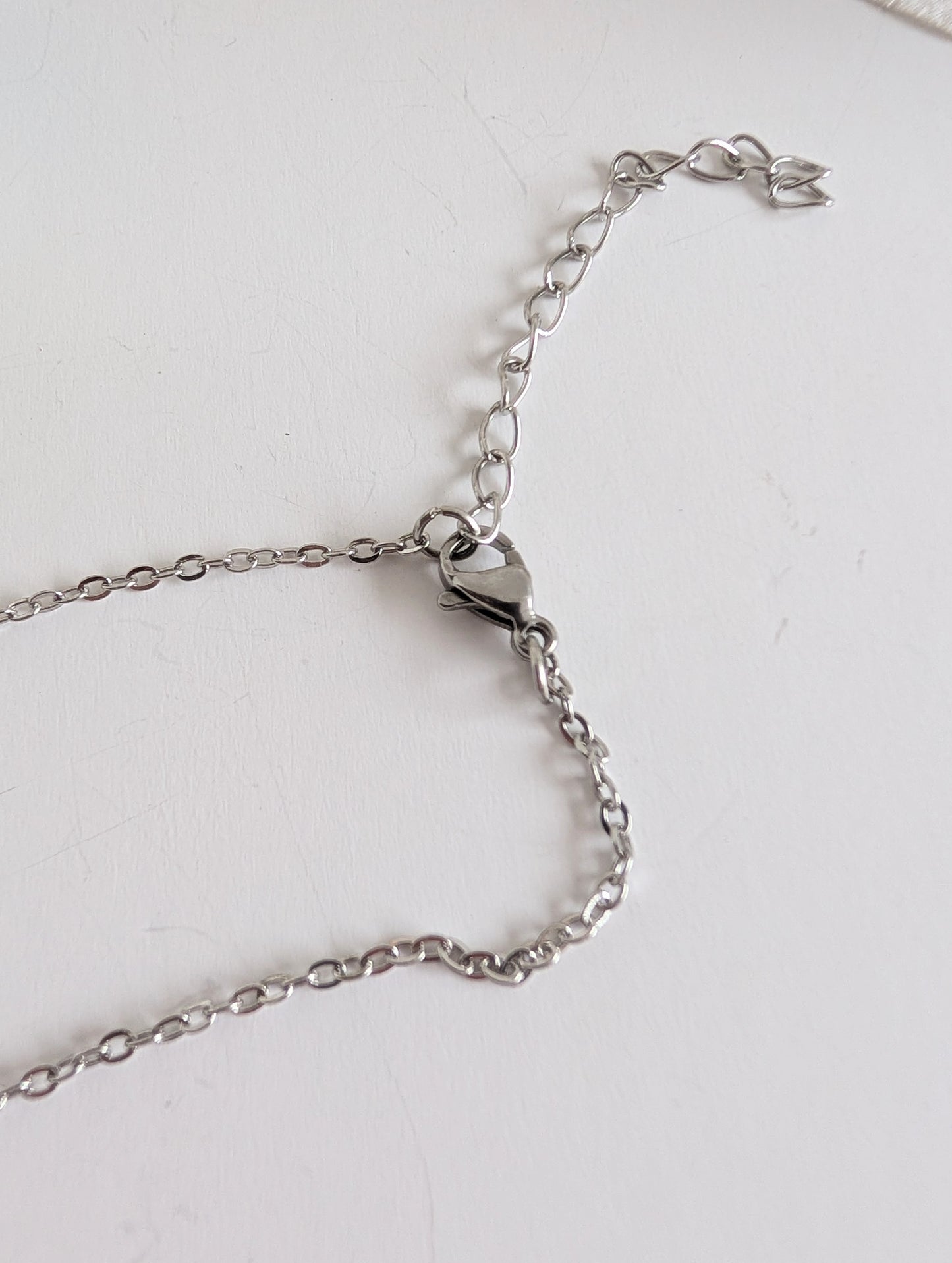 Ethnic necklace with Aztec style bird pendant - Polymer clay & 316L stainless steel - Anthracite and white - Approximately 42 cm length